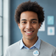 A smiling young adult looking at the camera, conveying trust and happiness.